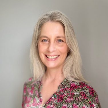 Jenny Warwick, smiling warmly, professional headshot