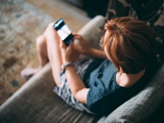 Woman reading phone messages.